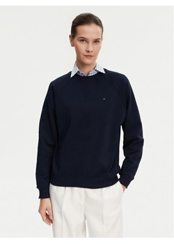 Tommy Hilfiger Bluza UW0UW05771 Granatowy Regular Fit ze sklepu MODIVO w kategorii Bluzy damskie - zdjęcie 181039671
