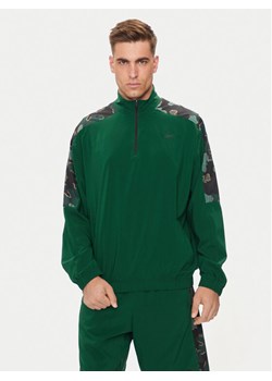 Reebok Bluza Train Motion 100075353 Zielony Relaxed Fit ze sklepu MODIVO w kategorii Bluzy męskie - zdjęcie 181042891