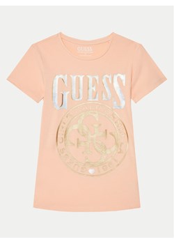 Guess T-Shirt J5RI20 K6YW4 Koralowy Regular Fit ze sklepu MODIVO w kategorii Bluzki dziewczęce - zdjęcie 181043544