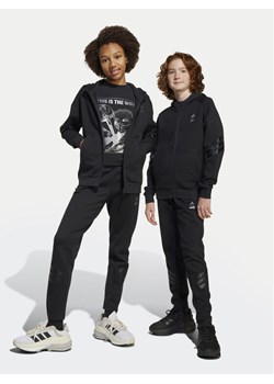 adidas Spodnie dresowe Star Wars The Mandalorian™ JF3635 Czarny Regular Fit ze sklepu MODIVO w kategorii Spodnie chłopięce - zdjęcie 181043594