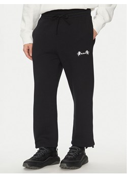 Nike Spodnie dresowe FB7127 Czarny Standard Fit ze sklepu MODIVO w kategorii Spodnie męskie - zdjęcie 181044193