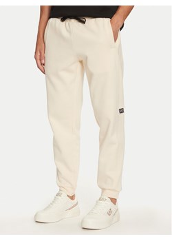 EA7 Emporio Armani Spodnie dresowe 6DPP58 PJVTZ 1713 Beżowy Regular Fit ze sklepu MODIVO w kategorii Spodnie męskie - zdjęcie 181050480