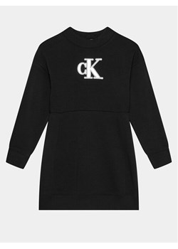 Calvin Klein Jeans Sukienka dzianinowa Metallic Monogram IG0IG02315 Czarny Regular Fit ze sklepu MODIVO w kategorii Sukienki dziewczęce - zdjęcie 181051112
