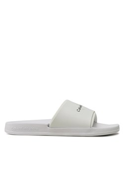 Calvin Klein Jeans Klapki Slide Monogram Tpu YM0YM00361 Biały ze sklepu MODIVO w kategorii Klapki męskie - zdjęcie 181051350