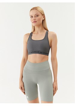Under Armour Biustonosz sportowy Ua Crossback Mid Bra 1361034 Szary Compression Fit ze sklepu MODIVO w kategorii Biustonosze - zdjęcie 181053592