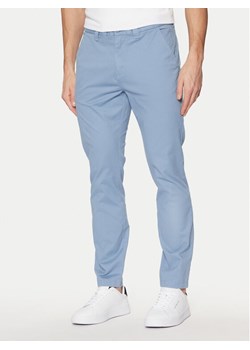 Tommy Jeans Chinosy Austin DM0DM20282 Niebieski Slim Fit ze sklepu MODIVO w kategorii Spodnie męskie - zdjęcie 181054433