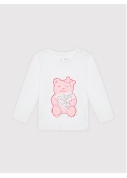 Guess Bluzka K1YI22 K6YW1 Biały Regular Fit ze sklepu MODIVO w kategorii Bluzki dziewczęce - zdjęcie 181055551