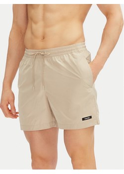 Calvin Klein Swimwear Szorty kąpielowe KM0KM01111 Beżowy Regular Fit ze sklepu MODIVO w kategorii Kąpielówki - zdjęcie 181057102