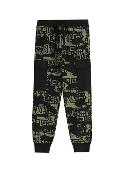 Coccodrillo Spodnie dresowe WC5120101GBJ Czarny Slim Fit ze sklepu MODIVO w kategorii Spodnie chłopięce - zdjęcie 181057574