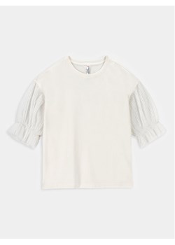 Coccodrillo Bluzka ZC3143103EJG Écru Regular Fit ze sklepu MODIVO w kategorii Bluzki dziewczęce - zdjęcie 181058802