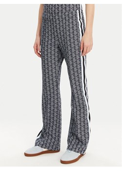 Lacoste Spodnie dresowe XF9313 Granatowy Regular Fit ze sklepu MODIVO w kategorii Spodnie damskie - zdjęcie 181060121