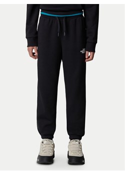 The North Face Spodnie dresowe NF0A8BHT Czarny Regular Fit ze sklepu MODIVO w kategorii Spodnie chłopięce - zdjęcie 181064201