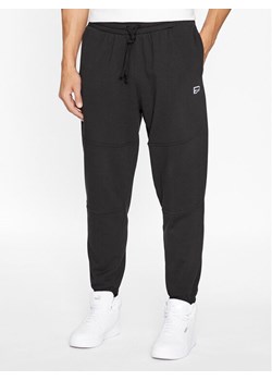 Puma Spodnie dresowe Downtown 621287 01 Czarny Regular Fit ze sklepu MODIVO w kategorii Spodnie męskie - zdjęcie 181066603