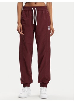 Converse Spodnie dresowe Star Printer 10026055-A02 Bordowy Tapered Fit ze sklepu MODIVO w kategorii Spodnie damskie - zdjęcie 181067270