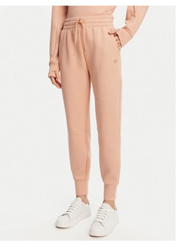 Lacoste Spodnie dresowe XF0343 Pomarańczowy Regular Fit ze sklepu MODIVO w kategorii Spodnie damskie - zdjęcie 181069992