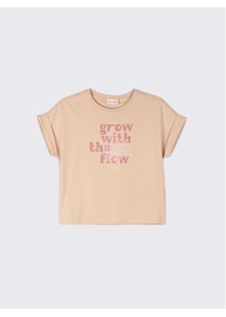 Coccodrillo T-Shirt WC2143203GRO Beżowy Relaxed Fit ze sklepu MODIVO w kategorii Bluzki dziewczęce - zdjęcie 181071024