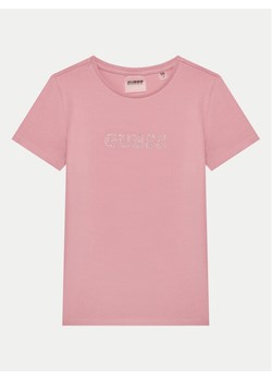 Guess T-Shirt J4RI49 J1314 Różowy Regular Fit ze sklepu MODIVO w kategorii Bluzki dziewczęce - zdjęcie 181076604