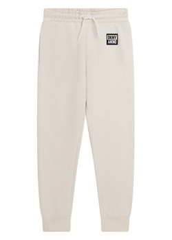 DKNY Spodnie dresowe D34A85 S Biały Regular Fit ze sklepu MODIVO w kategorii Spodnie dziewczęce - zdjęcie 181078480