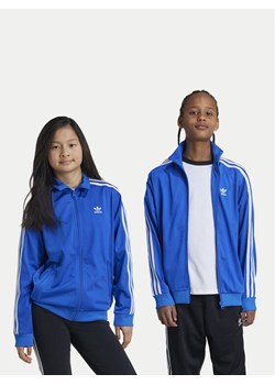adidas Bluza Firebird IY9799 Niebieski Regular Fit ze sklepu MODIVO w kategorii Bluzy dziewczęce - zdjęcie 181082270