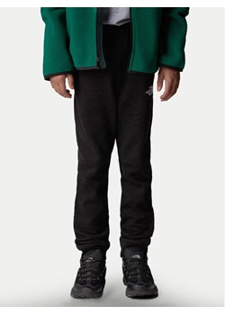 The North Face Spodnie dresowe NF0A89PD Czarny Regular Fit ze sklepu MODIVO w kategorii Spodnie chłopięce - zdjęcie 181083012