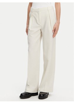 Calvin Klein Spodnie palazzo K20K208217 Beżowy Wide Leg ze sklepu MODIVO w kategorii Spodnie damskie - zdjęcie 181084481