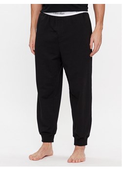 Calvin Klein Underwear Spodnie piżamowe 000NM2302E Czarny Regular Fit ze sklepu MODIVO w kategorii Piżamy męskie - zdjęcie 181085774
