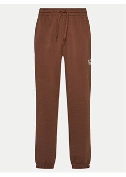 Reebok Spodnie dresowe Cl Ae Pant 100202799 Brązowy Regular Fit ze sklepu MODIVO w kategorii Spodnie damskie - zdjęcie 181086710
