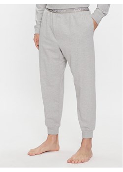 Calvin Klein Underwear Spodnie piżamowe 000NM2175E Szary Relaxed Fit ze sklepu MODIVO w kategorii Piżamy męskie - zdjęcie 181086962