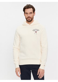 Tommy Hilfiger Bluza Arched Varsity MW0MW33641 Beżowy Regular Fit ze sklepu MODIVO w kategorii Bluzy męskie - zdjęcie 181089980