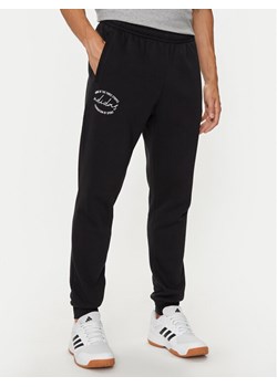 adidas Spodnie dresowe Brand Love IW3523 Czarny Loose Fit ze sklepu MODIVO w kategorii Spodnie męskie - zdjęcie 181090922