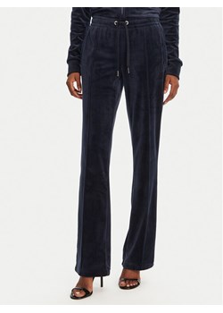 Juicy Couture Spodnie dresowe Tina JCAPW045 Granatowy Regular Fit ze sklepu MODIVO w kategorii Spodnie damskie - zdjęcie 181093422