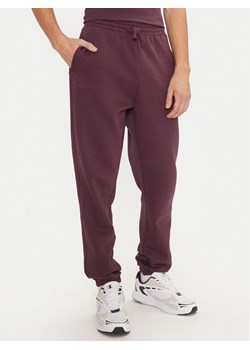 Champion Spodnie dresowe 220424 Fioletowy Regular Fit ze sklepu MODIVO w kategorii Spodnie męskie - zdjęcie 181095924