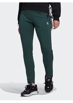 adidas Spodnie dresowe Always Original Laced HK5083 Zielony Slim Fit ze sklepu MODIVO w kategorii Spodnie damskie - zdjęcie 181096040