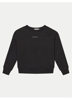 Calvin Klein Jeans Bluza Monogram IB0IB02258 Czarny Regular Fit ze sklepu MODIVO w kategorii Bluzy chłopięce - zdjęcie 181096101