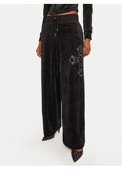 Juicy Couture Spodnie dresowe Jerry Cross JCBBJ224833 Czarny Wide Leg ze sklepu MODIVO w kategorii Spodnie damskie - zdjęcie 181098740