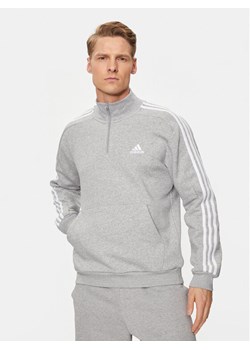 adidas Bluza Essentials Fleece 3-Stripes IJ8905 Szary Regular Fit ze sklepu MODIVO w kategorii Bluzy męskie - zdjęcie 181100641