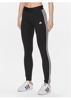 adidas Legginsy Loungewear Essentials 3-Stripes GL0723 Czarny Extra Slim Fit ze sklepu MODIVO w kategorii Spodnie damskie - zdjęcie 181108714