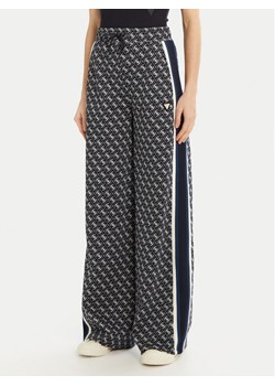 Guess Spodnie dresowe V5RB03 KCO90 Czarny Palazzo Fit ze sklepu MODIVO w kategorii Spodnie damskie - zdjęcie 181109040