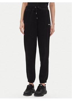 DKNY Sport Spodnie dresowe DP5P3632 Czarny Relaxed Fit ze sklepu MODIVO w kategorii Spodnie damskie - zdjęcie 181112773