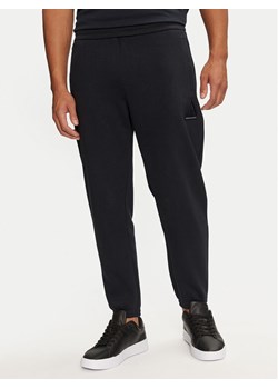 Armani Exchange Spodnie dresowe 6DZPJA ZJNKZ 1510 Granatowy Regular Fit ze sklepu MODIVO w kategorii Spodnie męskie - zdjęcie 181112884