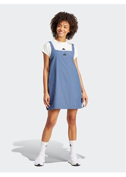 adidas Sukienka letnia City Escape IS0670 Niebieski Loose Fit ze sklepu MODIVO w kategorii Sukienki - zdjęcie 181113384