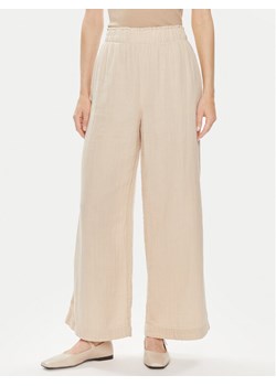Gap Spodnie materiałowe 855967-01 Beżowy Relaxed Fit ze sklepu MODIVO w kategorii Spodnie damskie - zdjęcie 181113753