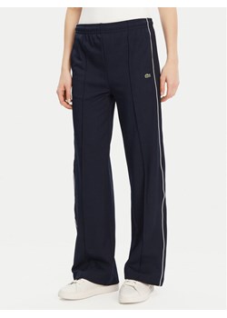 Lacoste Spodnie dresowe XF7260 Granatowy Relaxed Fit ze sklepu MODIVO w kategorii Spodnie damskie - zdjęcie 181115510