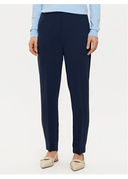 Tommy Hilfiger Chinosy WW0WW45450 Granatowy Slim Fit ze sklepu MODIVO w kategorii Spodnie damskie - zdjęcie 181117813
