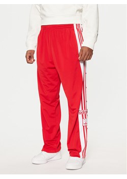 adidas Spodnie dresowe Adibreak JP3765 Czerwony Regular Fit ze sklepu MODIVO w kategorii Spodnie męskie - zdjęcie 181122914
