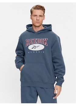 Reebok Bluza Archive Essentials IM1528 Niebieski Regular Fit ze sklepu MODIVO w kategorii Bluzy męskie - zdjęcie 181125304