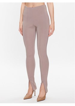 Calvin Klein Legginsy K20K205357 Beżowy Slim Fit ze sklepu MODIVO w kategorii Spodnie damskie - zdjęcie 181125690
