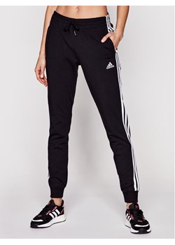 adidas Spodnie dresowe 3-Stripes GM5542 Czarny Slim Fit ze sklepu MODIVO w kategorii Spodnie damskie - zdjęcie 181127354