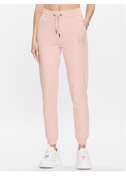 Armani Exchange Spodnie dresowe 3RYP94 YJCZZ 14AO Różowy Regular Fit ze sklepu MODIVO w kategorii Spodnie damskie - zdjęcie 181127983