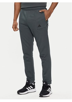 adidas Spodnie dresowe Pump Workout IT4311 Zielony Regular Fit ze sklepu MODIVO w kategorii Spodnie męskie - zdjęcie 181128751